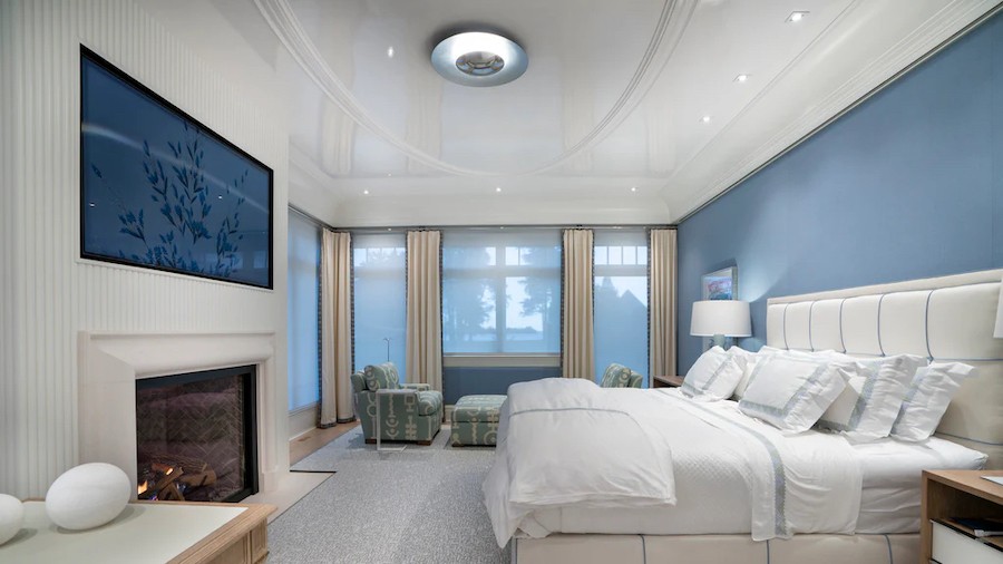 A beautifully designed bedroom with invisible audio speakers fully integrated into the walls. 