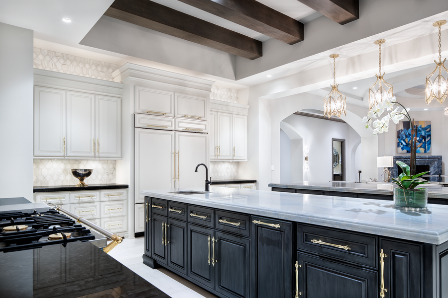 An open kitchen space featuring Lutron lighting fixtures and overall design.